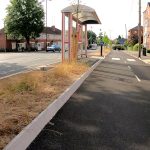Coventry's Coundon Cycleway, a bidirectional route. This image also includes a pedestrian footpath and zebra crossing, a bus stop, and a general traffic road. It therefore illustrates multi-modal transport.